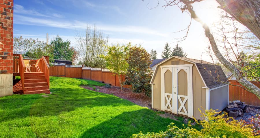 Fenced backyard with storage shed in Newark